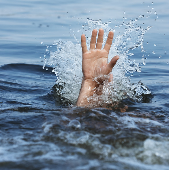 A hand reaching above the water